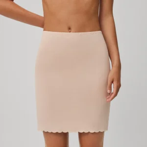 Jupe combinée découpée au laser nude